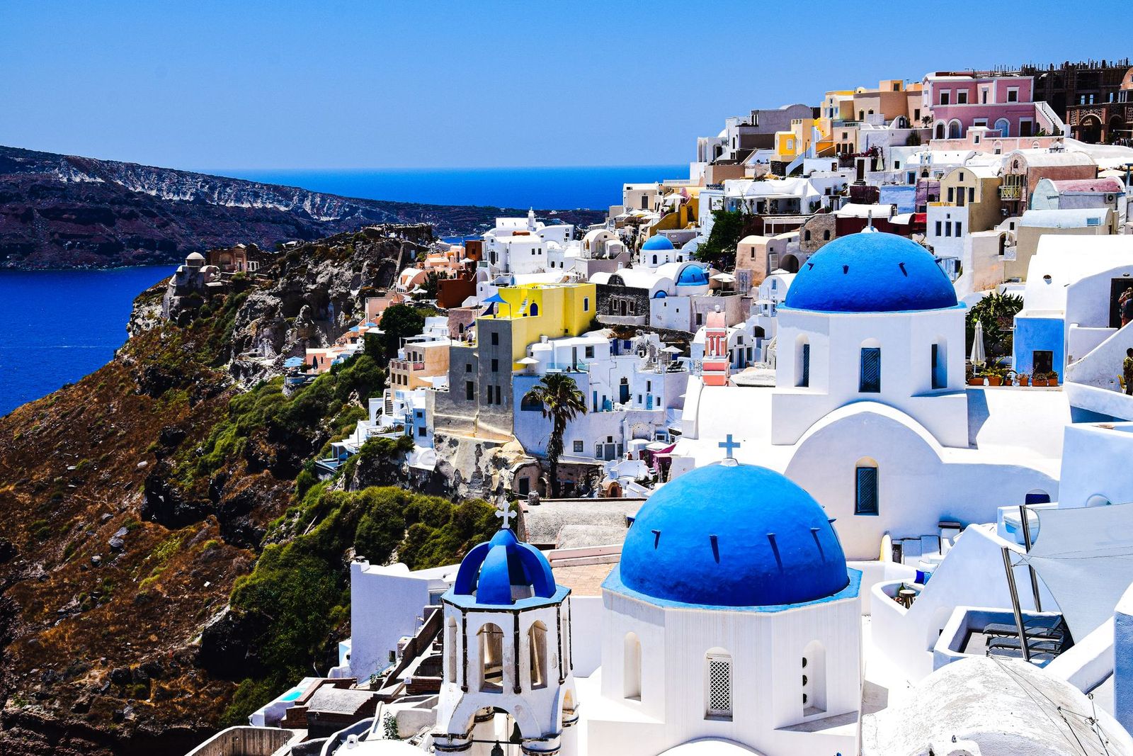 Whitewashed houses above the Aegean Sea on a Greek island